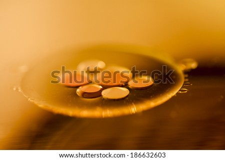 Abstract composition of oil drops on a water surface with very soft focus 