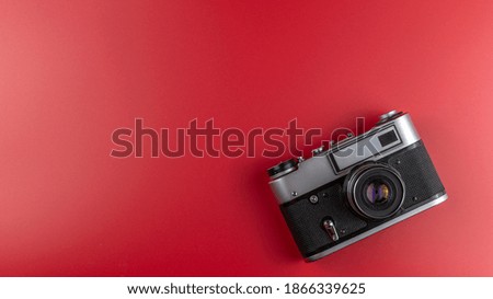 Old camera on a red background