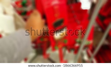 Blurry view of christmas marketstore. people ready to searching gift for holiday. religion concept background.