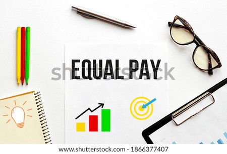 Paper plate, glasses, notepad,pen and pencils on the white background. Business concept. Text Equal Pay