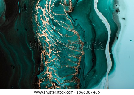 Acrylic Fluid Art. Dark green waves in abstract ocean and golden foamy waves. Marble effect background or texture. Royalty-Free Stock Photo #1866387466