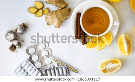 Products for the treatment of common cold - lemon, ginger, chamomile tea. Vitamin natural drink. Cinnamon anise star. Natural medicine vs conventional medicine Royalty-Free Stock Photo #1866391117