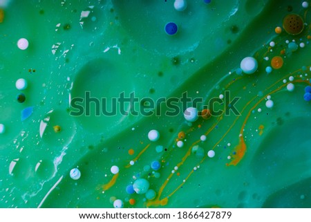 Abstract blurred background with colorful gradient colors. Oil drops in water abstract psychedelic image pattern.