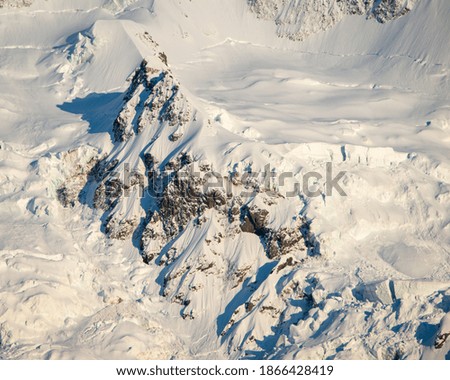 Close-up image of white snow lit up at sunrise, Mt Cook National Park