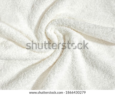 Towel texture close up. Terry cloth bath or beach towel. Soft fluffy textile. Top view. White towel macro material. Royalty-Free Stock Photo #1866430279