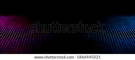 Abstract background texture of CloseUp LED light panel art soft focus blurred screen with dark black shadow space  for text.