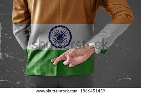 Businessman Jacket with Flag of India with his fingers crossed behind his back 