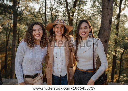 Three beautiful young caucasian women portrait. Smiling girls looking at the camera. Friendship and memories concept.