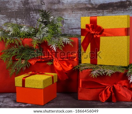 Christmas gift in red, gold packaging. Surprise in a box. Background and texture.