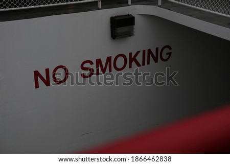 No smoking sign with the fence from the yacht 