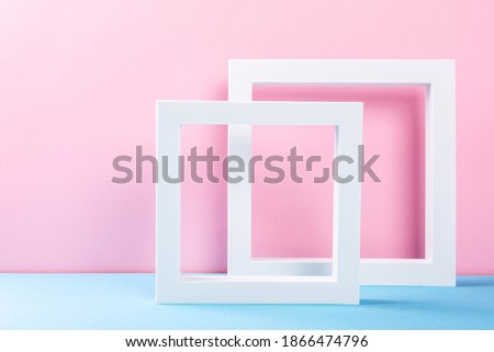Composition of different geometric objects white frames for products presentation or exhibitions. Colorful abstract background multicolored, light blue, pink. Trend Concept with copy space.