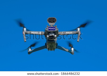 Police unmanned aircraft system, Drone flying, blue sky background