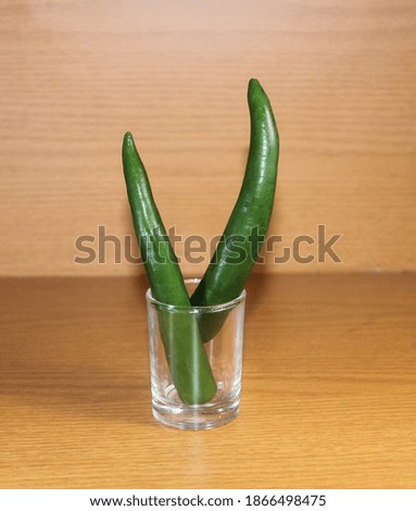 chilies in a glass on the table