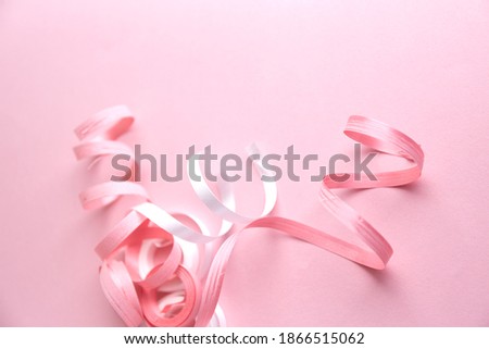 Delicate pink party decorations. Confetti on pink background