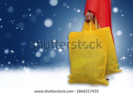 Closeup of woman hand holding shopping bags colorful Fabric on the street happy summer with copy space for text and logo