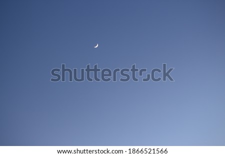 blue sky and white cloud,little moon hiding in the sky