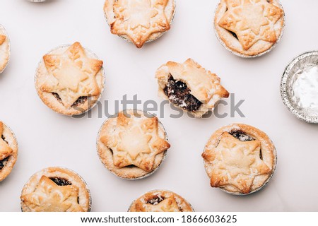 Mince pies, traditional christmas food from all butter shortcrust pastry filled with cranberries, sultanas, currants, raisins, along with festive spices, clementine juice, dash of brandy and cognac