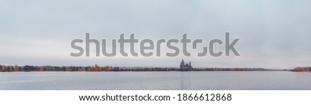 Historic site panorama of wooden churches of Kizhi Island, Republic of Karelia, Russia. The museum of wooden architecture. Onega lake autumn landscape at dawn.