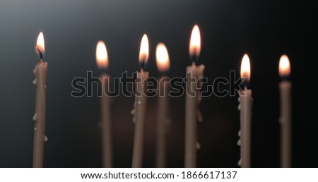 Candles burning on a church altar. Burning a candles on blurred background