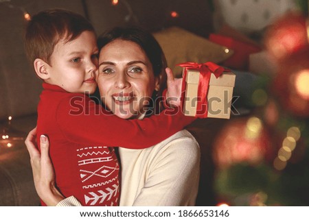 Portrait of a mother hugging her son.