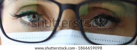 Portrait of a doctor in protective medical mask and glasses. Medical center services concept