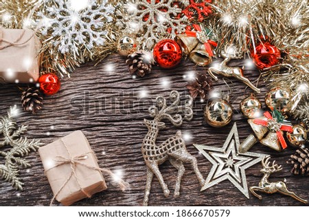 Merry Christmas holiday background. deer family and christmas ball decor. christmas reindeers with festive winter decor on wood background. Christmas and New Year minimalism concept. copy space