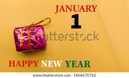 Happy New year,January 1st text and little christmas gift on yellow background.Vintage festive template design.