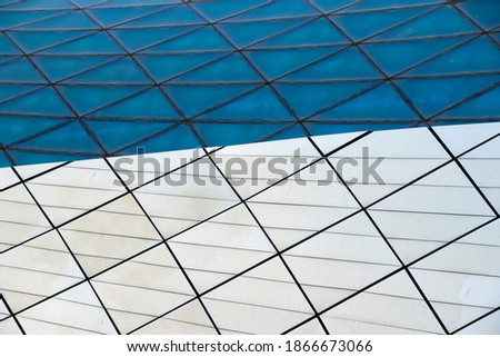 Metal and glass background, building exterior texture at sunset, sunlight and reflection, modern architecture