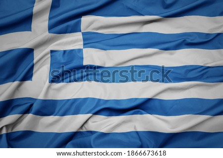 waving colorful national flag of greece. macro shot
