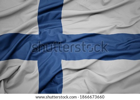 waving colorful national flag of finland. macro shot