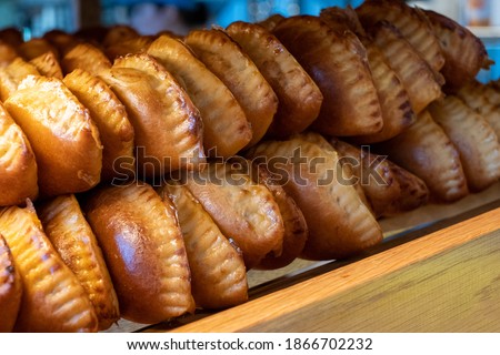 hot pies showcase. Pies on a basket in a bakery