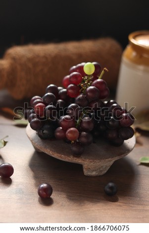 fresh grapes in black background . 