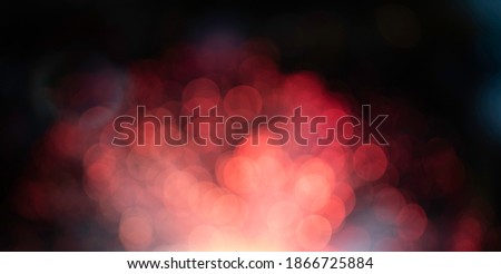 Abstract red bokeh background light effect with circle pattern.