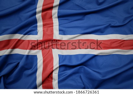 waving colorful national flag of iceland. macro shot