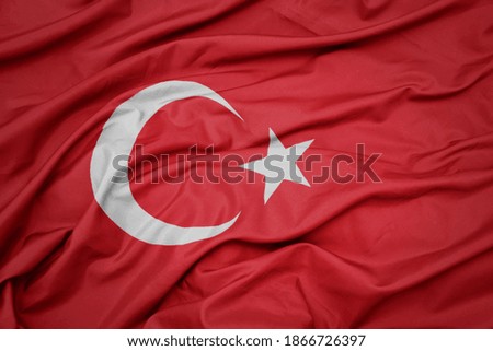 waving colorful national flag of turkey. macro shot