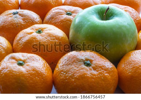 Granny smith green apple and mandarin oranges