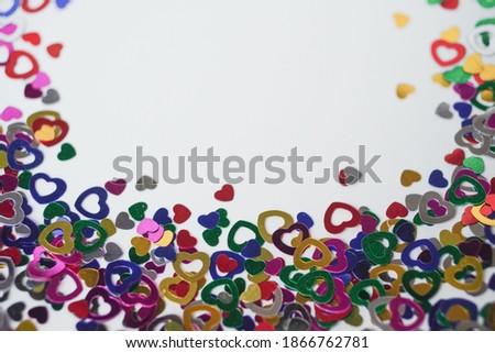 Heart shape colorful confetti as background. Happy Valentines Day, card, invitation. Bokeh effect.
