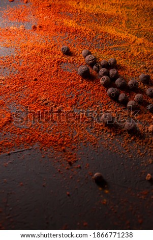 indian spices: paprika and curcuma on a black background 