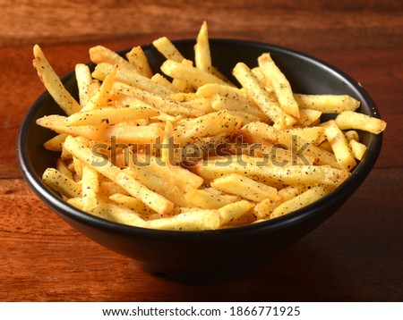Mix herb French fries, served in a plate over a rustic wooden background, indian cusine, selective focus Royalty-Free Stock Photo #1866771925
