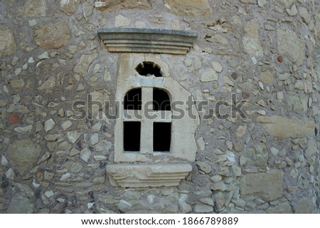stone walls of an old chapel in Greece