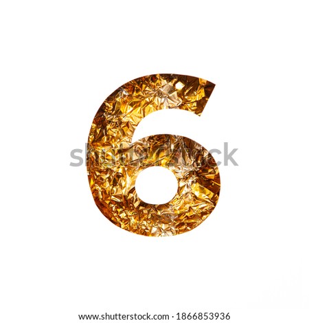 Number six made of gold crumpled foil and paper cut in shape of sixth numeral isolated on white. Festive golden typeface