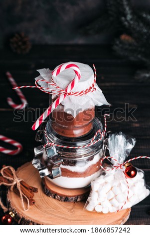 Christmas gift cookie mix and chocolate drink in glass jar