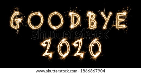 Goodbye 2020. Bright text made of sparkler on black background, banner design  Royalty-Free Stock Photo #1866867904