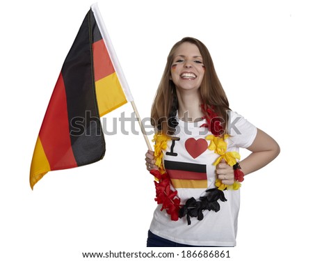 Attractive woman shows german flag and smiles in front of white background