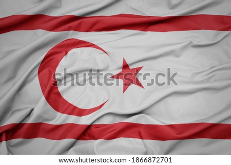 waving colorful national flag of northern cyprus. macro shot