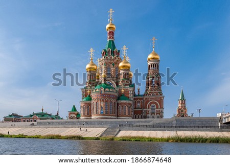 red brick Church in Russia near the river