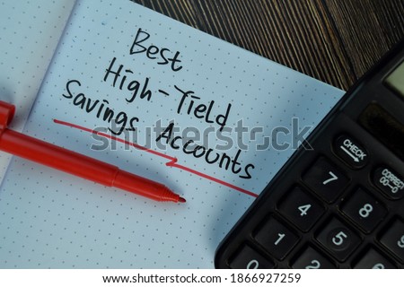 Best High-Yield Saving Accounts write on a book isolated on Wooden Table. Finance Concept