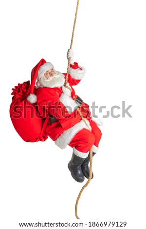 Santa Claus climbs, descends on a rope, on a white background. Royalty-Free Stock Photo #1866979129