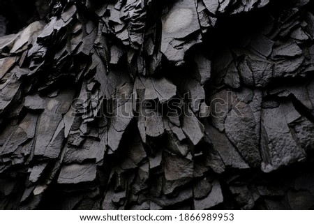 Textures and patterns of basalt volcanic rock formations at Hálsanefshellir Cave next to the Reynisfjara black sand beach, Iceland Royalty-Free Stock Photo #1866989953