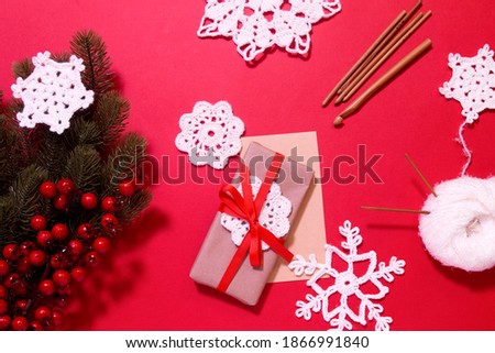Making of handmade Chrisrmas greeting card with crochet openwork snowflakes. Making of handmade decoration. New year crafts. Childrens DIY, hobby concept, gift with your own hands.